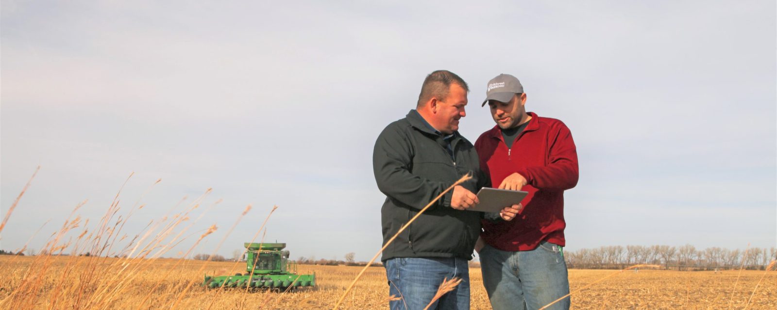 Josh Gossman, Crop Insurance Agent out of Pierce and a farmer in the field at harvest