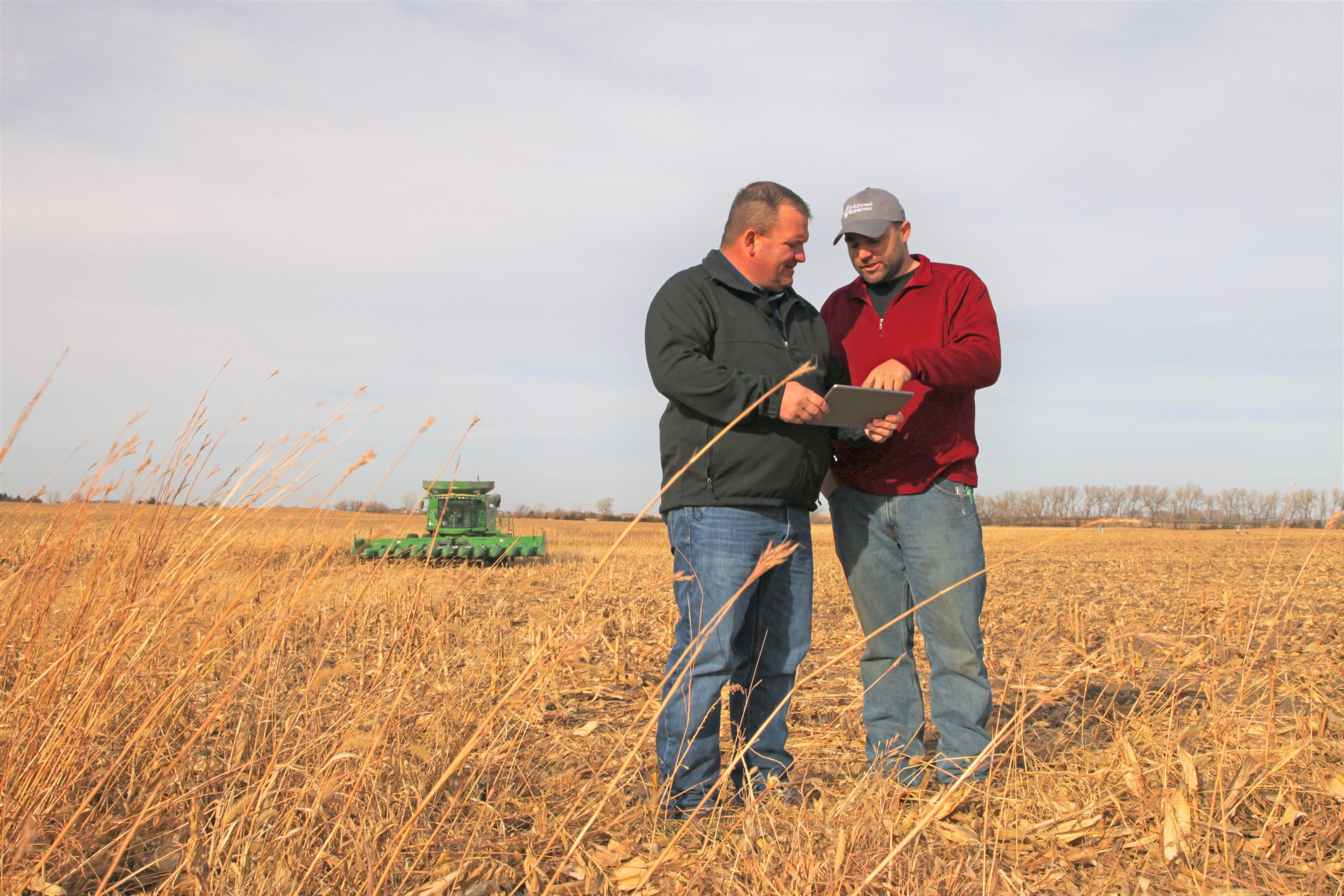 Josh Gossman, Crop Insurance Agent out of Pierce and a farmer in the field at harvest