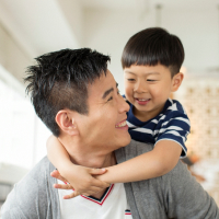 happy dad playing with his son