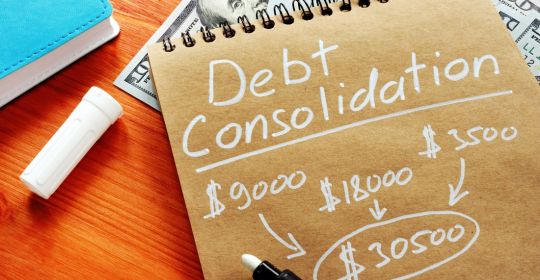 Debt consolidation written on a notebook