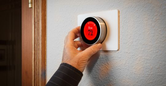 Adjusting a digital thermostat in a home