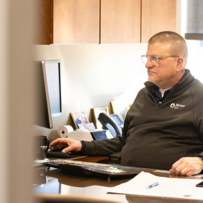 Dave working on his computer at his desk