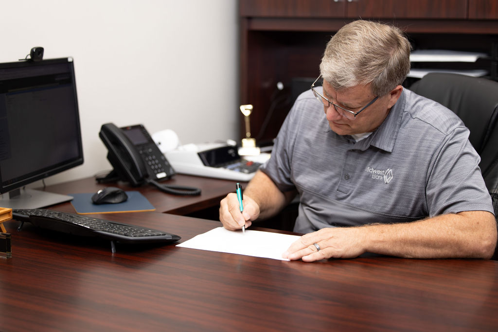 Kurt Sandall, Vice President out of Wisner, at his desk