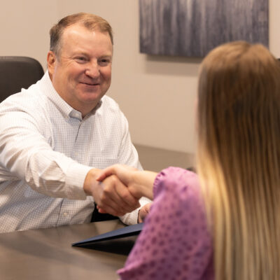Jeffry Phillips shaking hands with client.