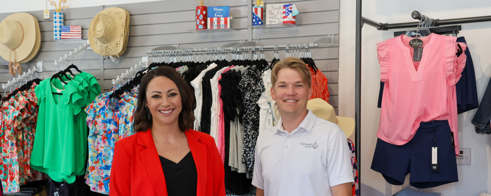 Jordan Rathke from Midwest Bank and the owner of Kirtsey's Boutique