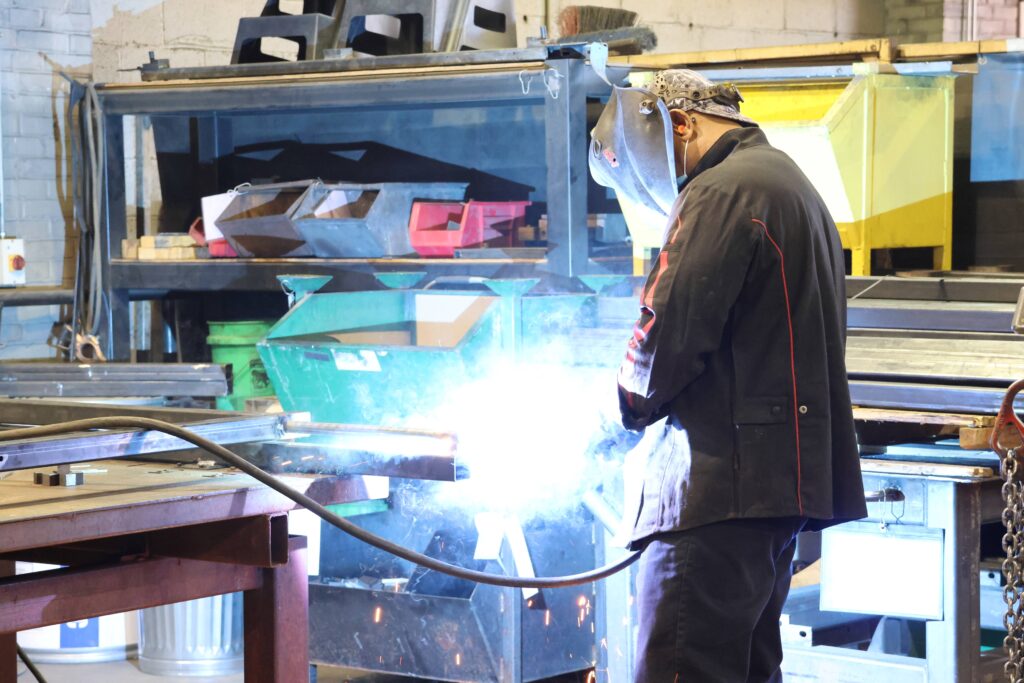 Bison employee welding