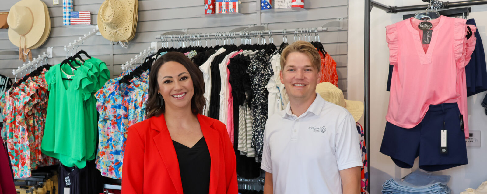 Jordan Rathke from Midwest Bank and Kirby the owner of the boutique