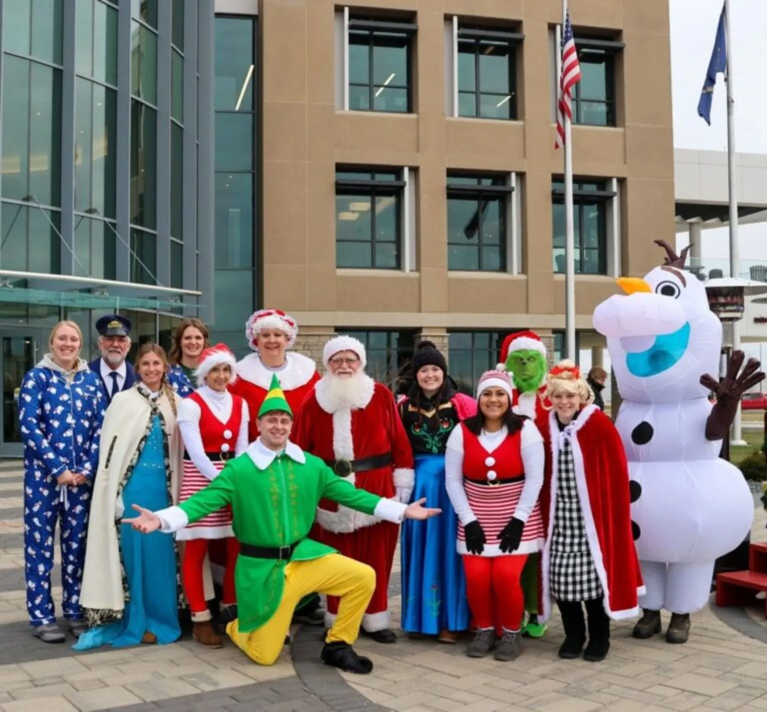 Staff dressed up as Christmas characters at Christmas on Cooper Drive